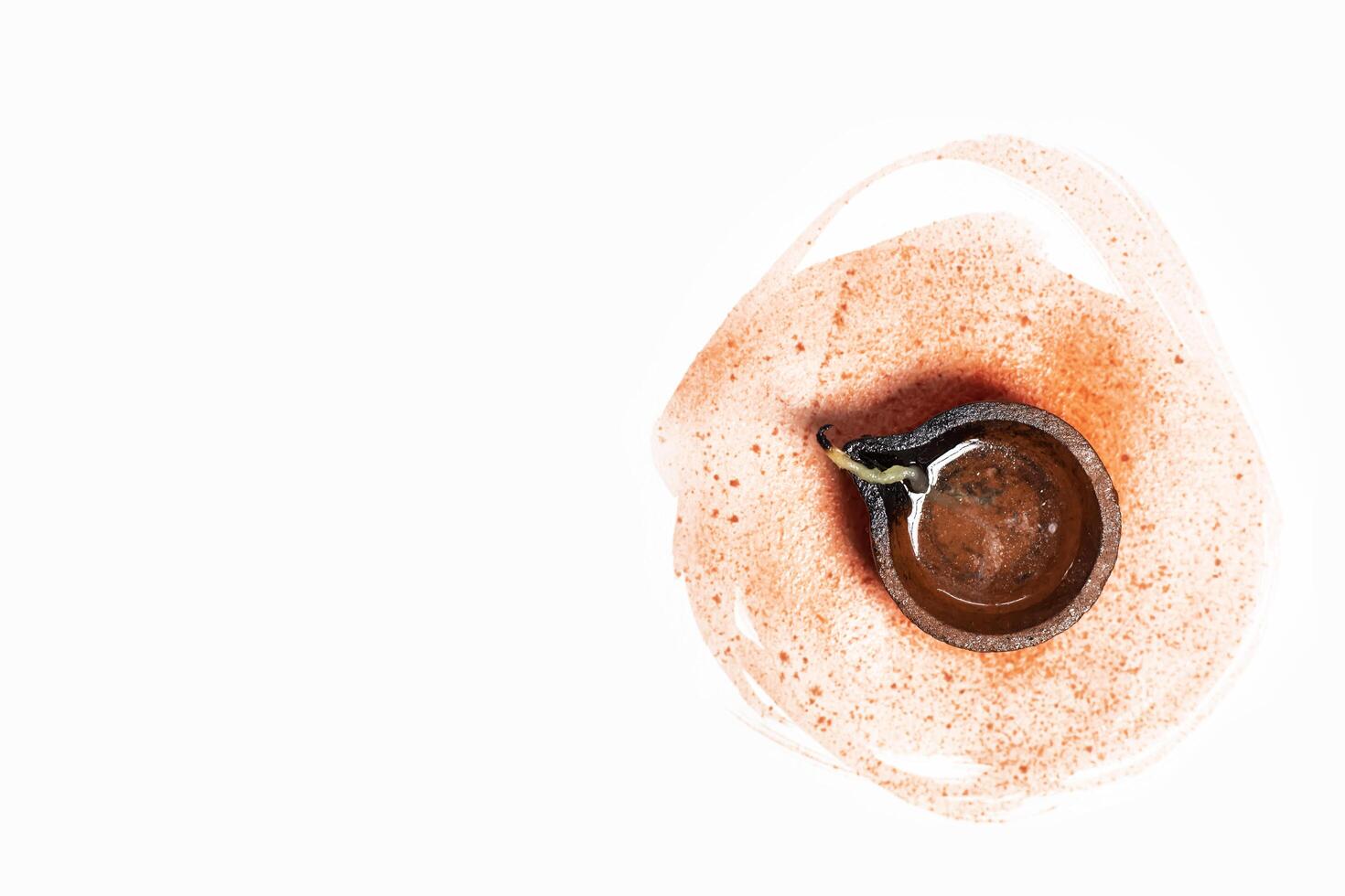 Top View of Clay Diya Lamp with Paint Stroke for Diwali Festivities. Closeup photo