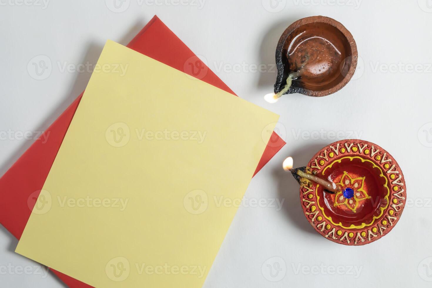 Diwali greeting card with lit diya lamp, Indian festival of Diwali. photo