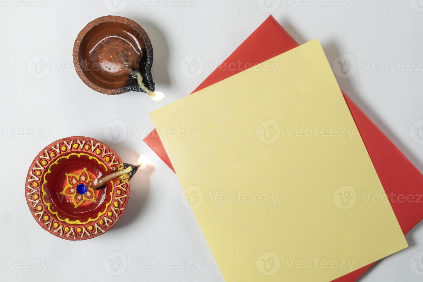 Diwali greeting card with lit diya lamp, Indian festival of Diwali. photo