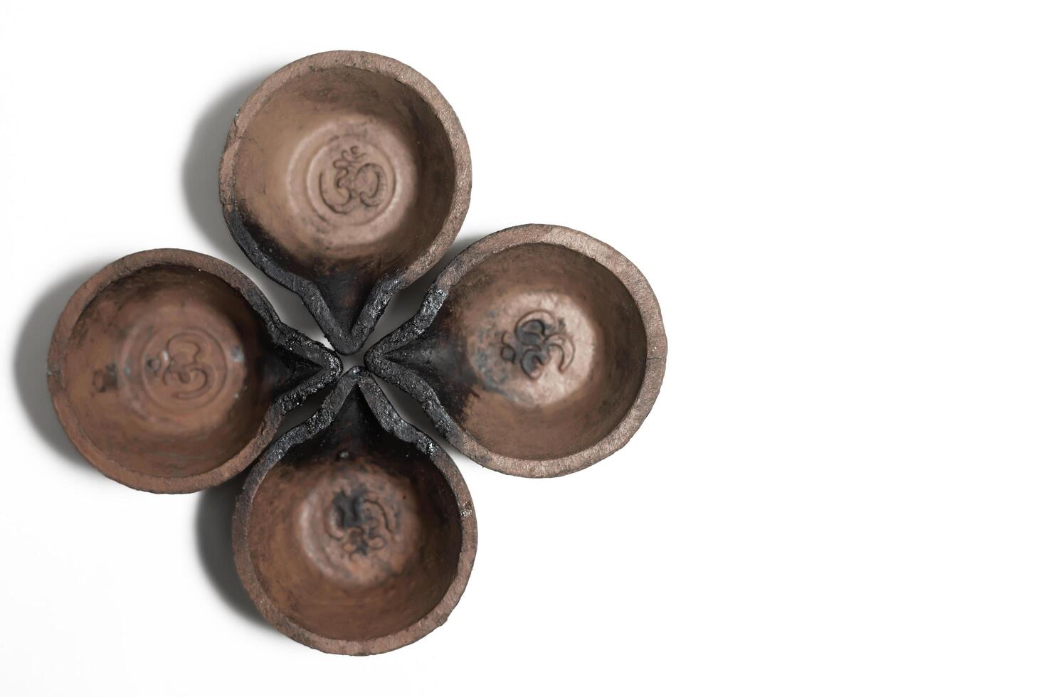 Traditional clay oil lamps are arranged in a flower pattern. Suitable for festive and religious celebrations. photo