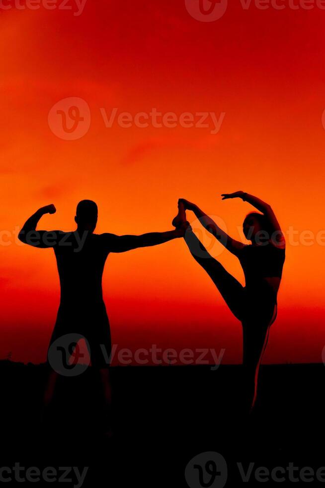 sporty couple together do sports training and stretching photo