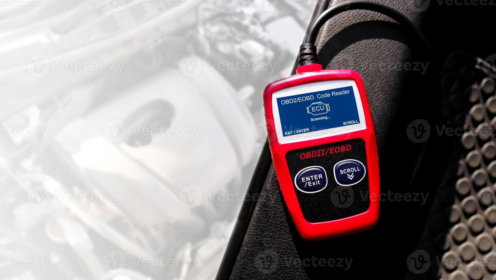 OBD or OBD2 scanner , The ECU or electronic control unit of car is scanned with an OBD2 or OBD scanner to analyze fault codes , copy space for text decoration , Car repair concept photo