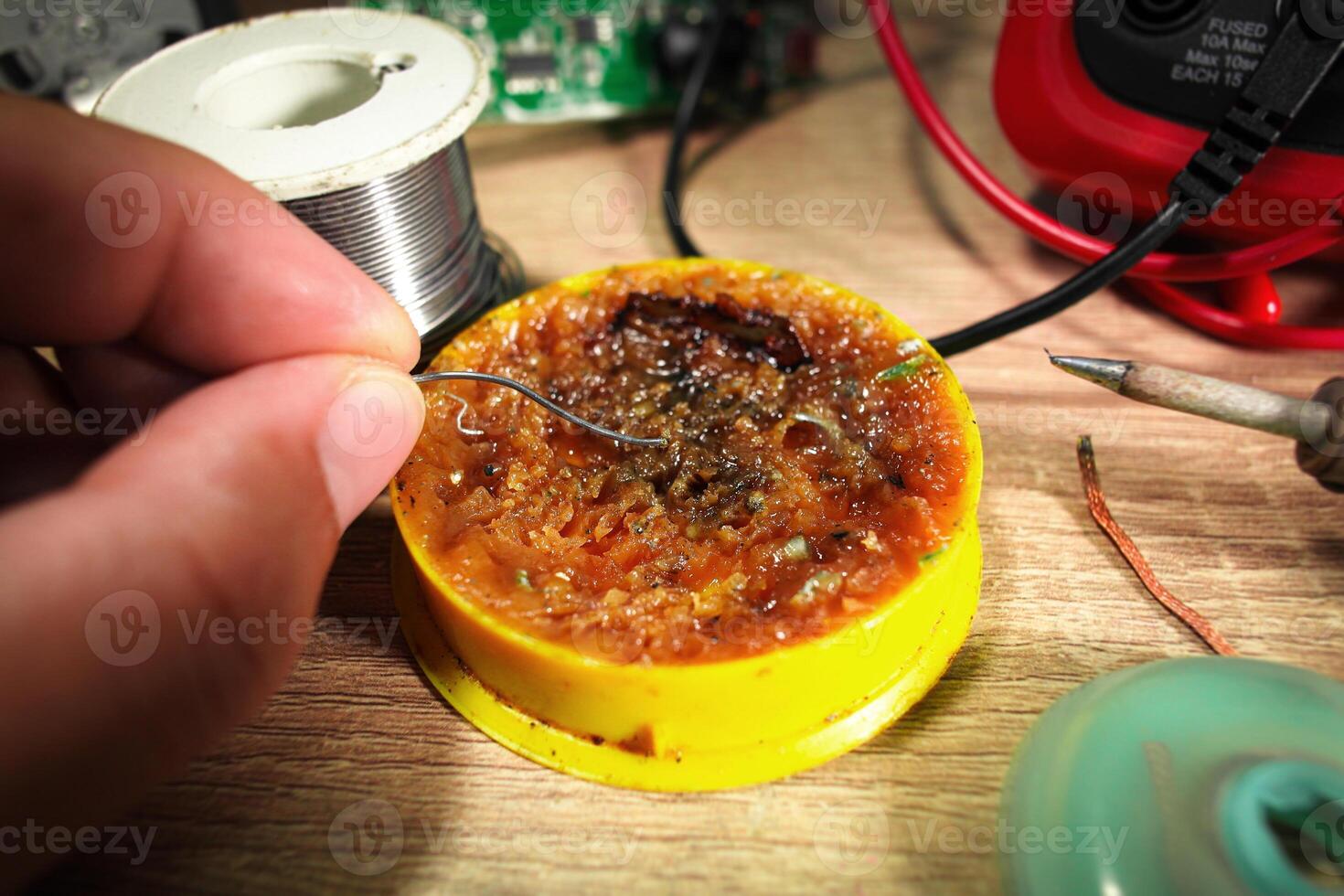 Close up of soldering paste or flux using by electrician for soldering lead , Electric appliance repair concept photo