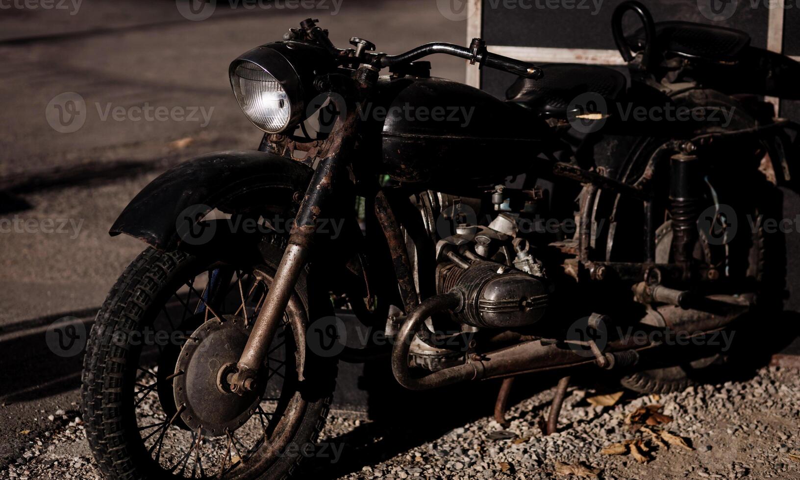 old rusty black motorcycle photo
