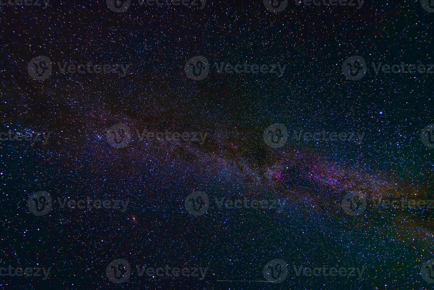 starry multicolored night sky with a bright milky way and galaxies photo