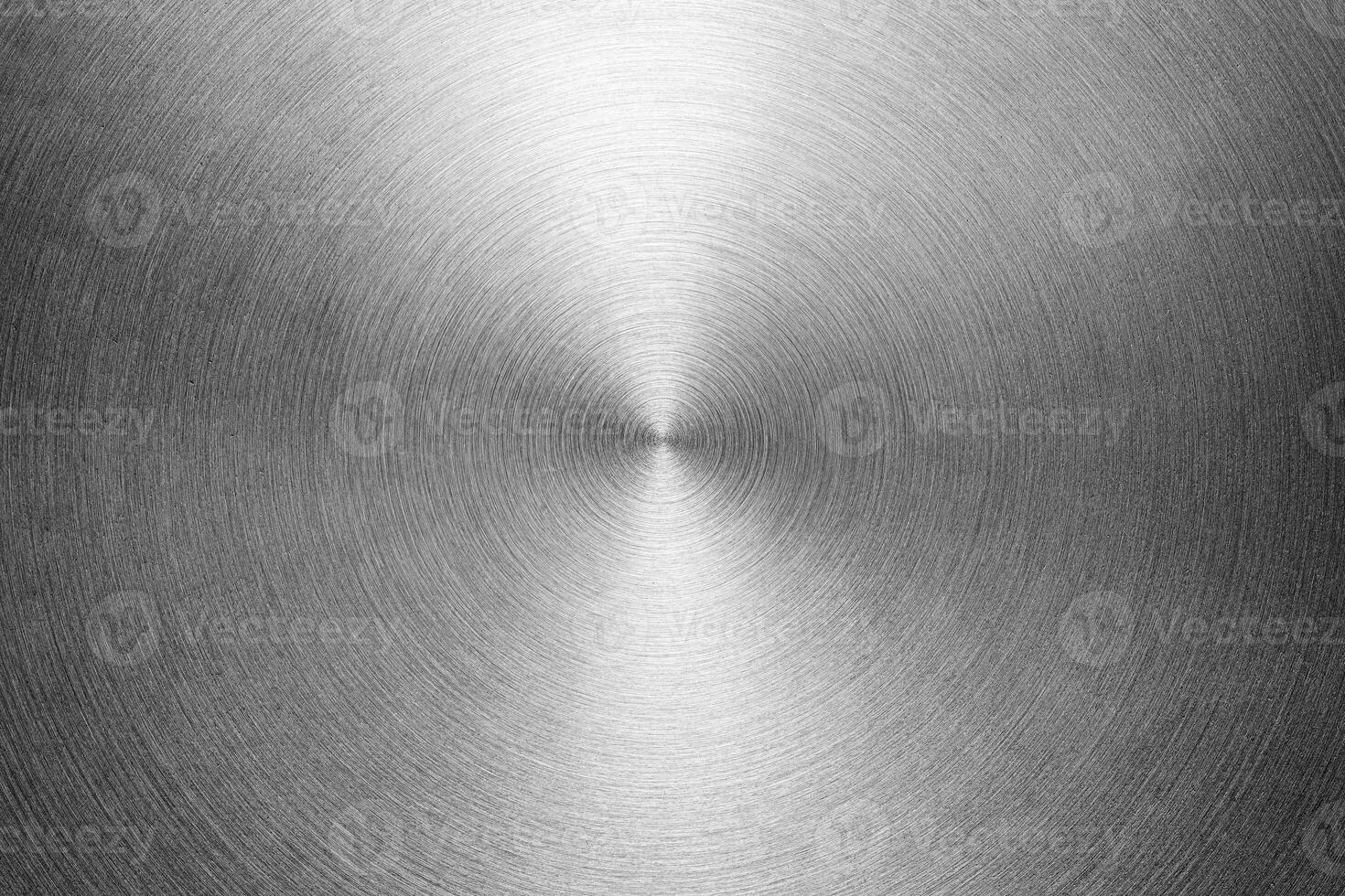 Stainless steel or aluminium circular brushed shiny metal texture. Abstract metallic background. Circle shape. photo