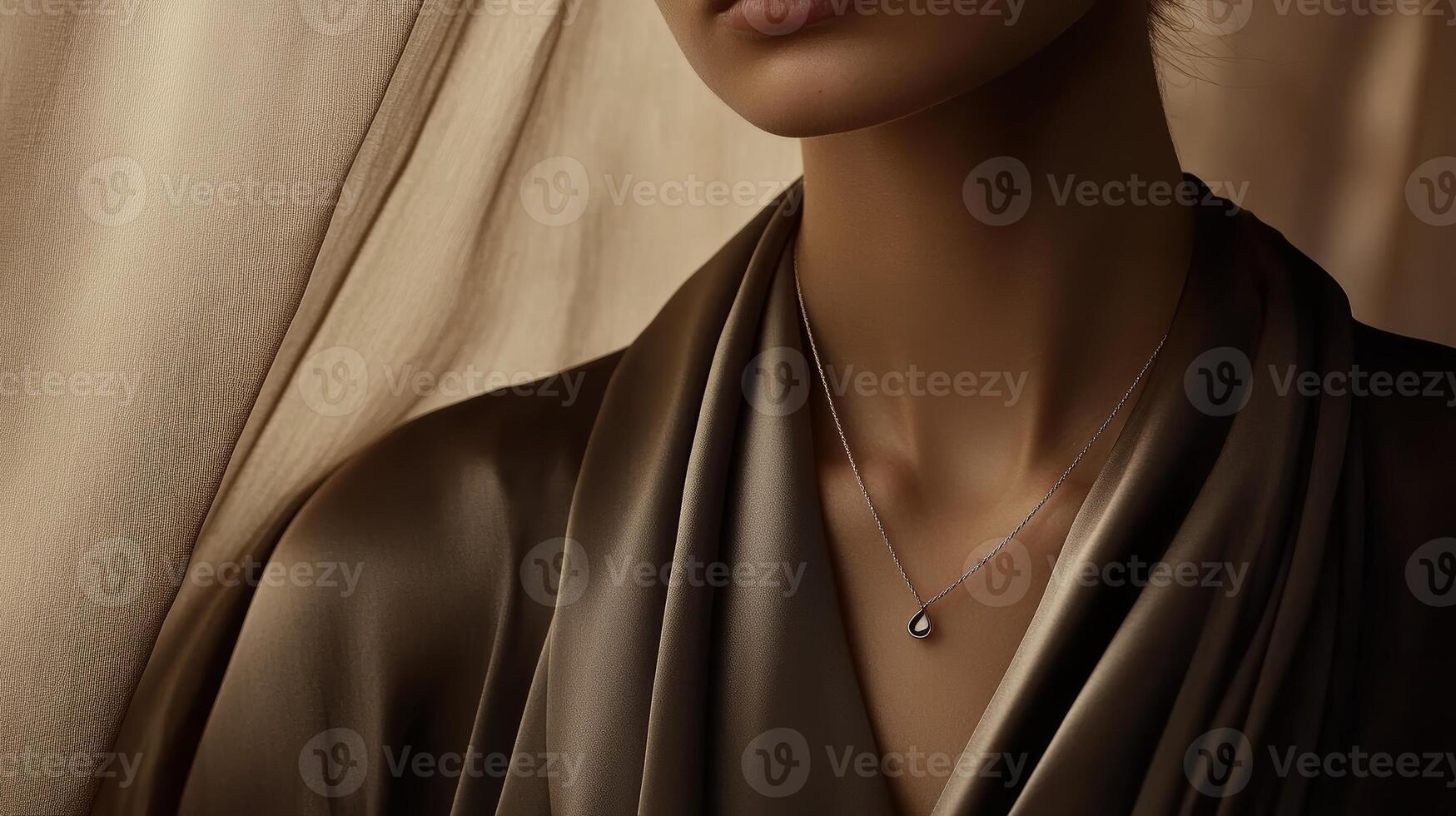 Minimalist Silver Necklace with Teardrop Pendant on Soft Neutral Background photo