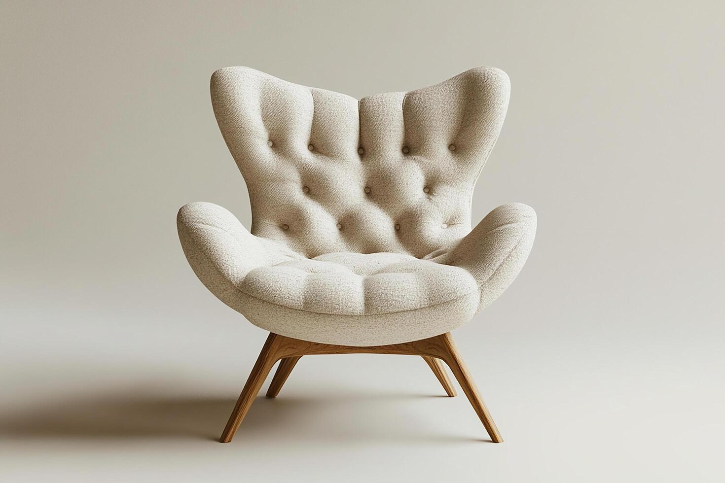 Chic modern chair with button tufts and angular wooden legs isolated photo