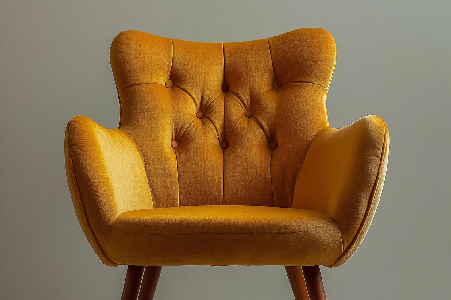 Chic modern chair with button tufts and angular wooden legs isolated photo