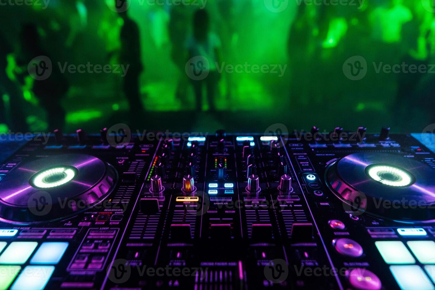DJ mixer controller Board for professional mixing of electronic music in a nightclub photo