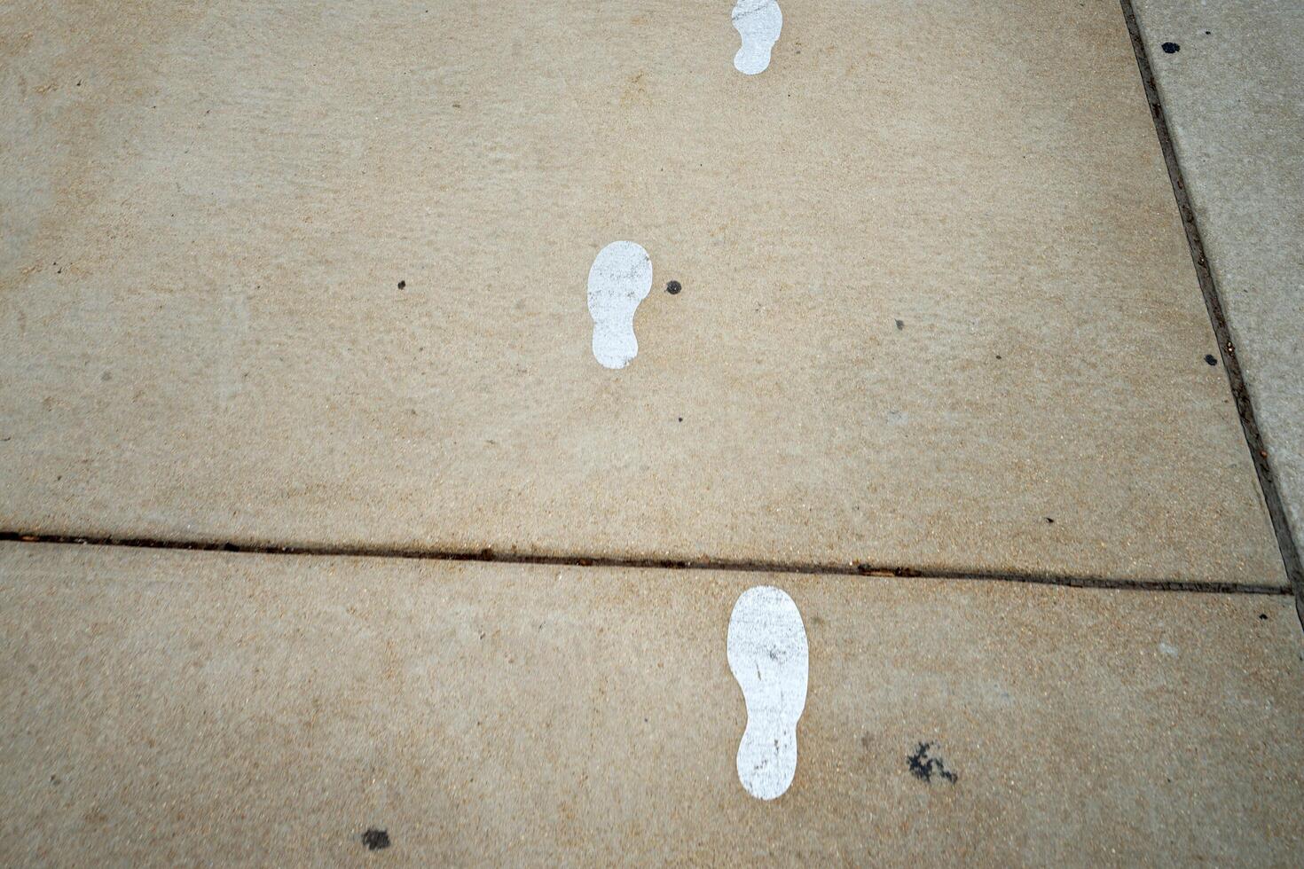 White footprints on concrete floor photo