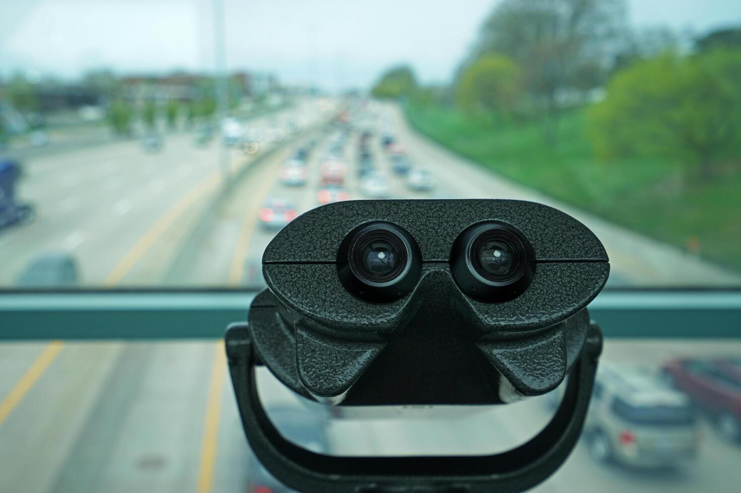 Close up coin operated public binoculars with street view photo