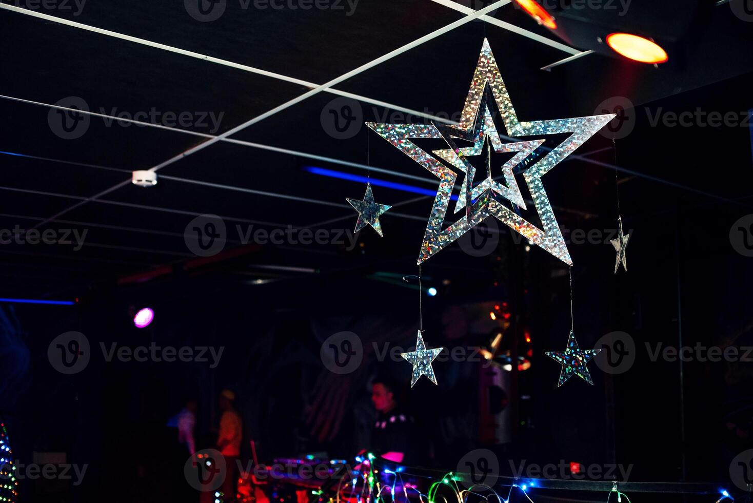 Christmas festive decorations of stars on a colorful background photo