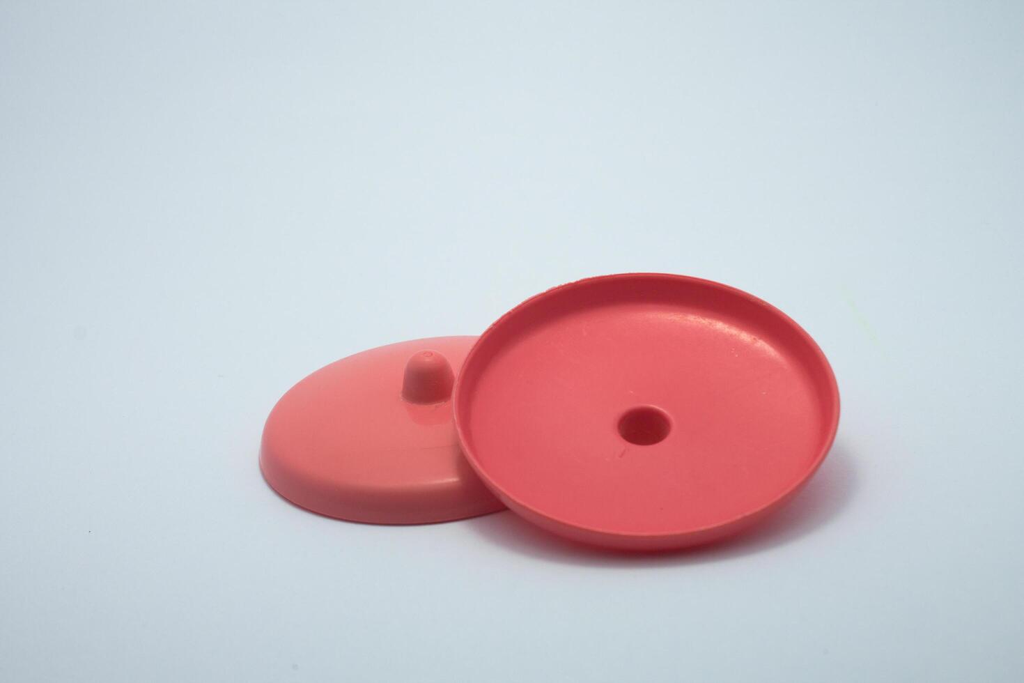red plastic cup lid isolated on white background photo