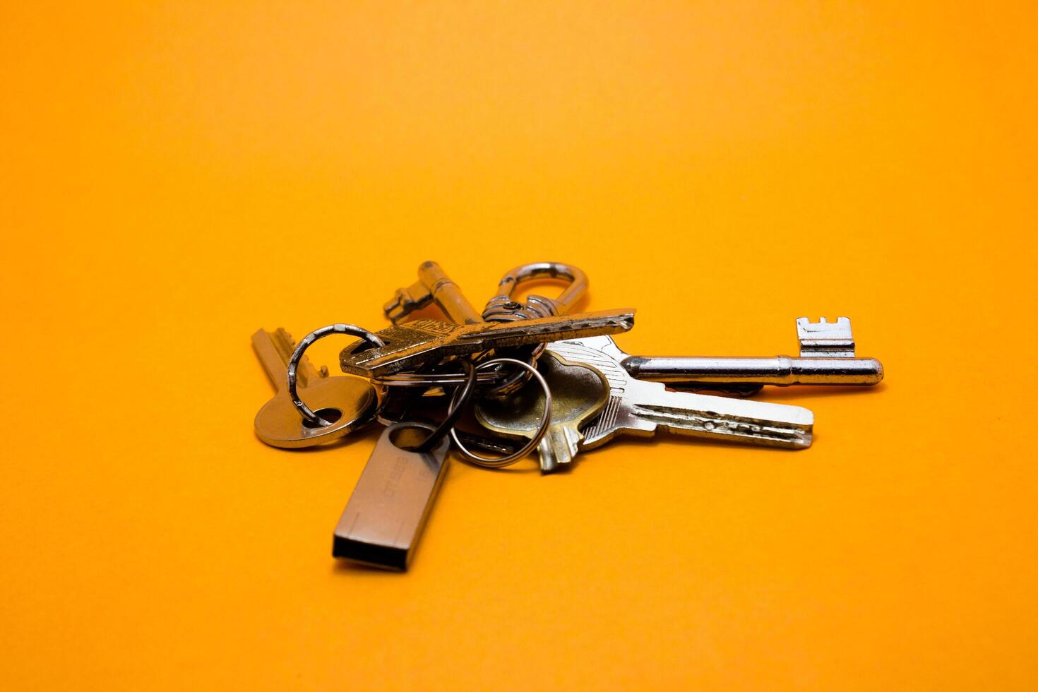 set of keys isolated yellow background photo