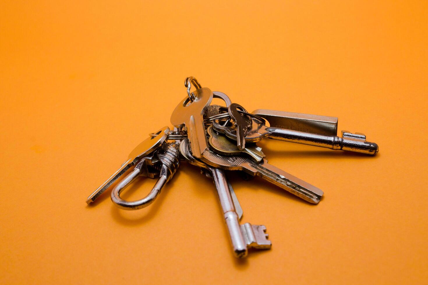 set of keys isolated yellow background photo
