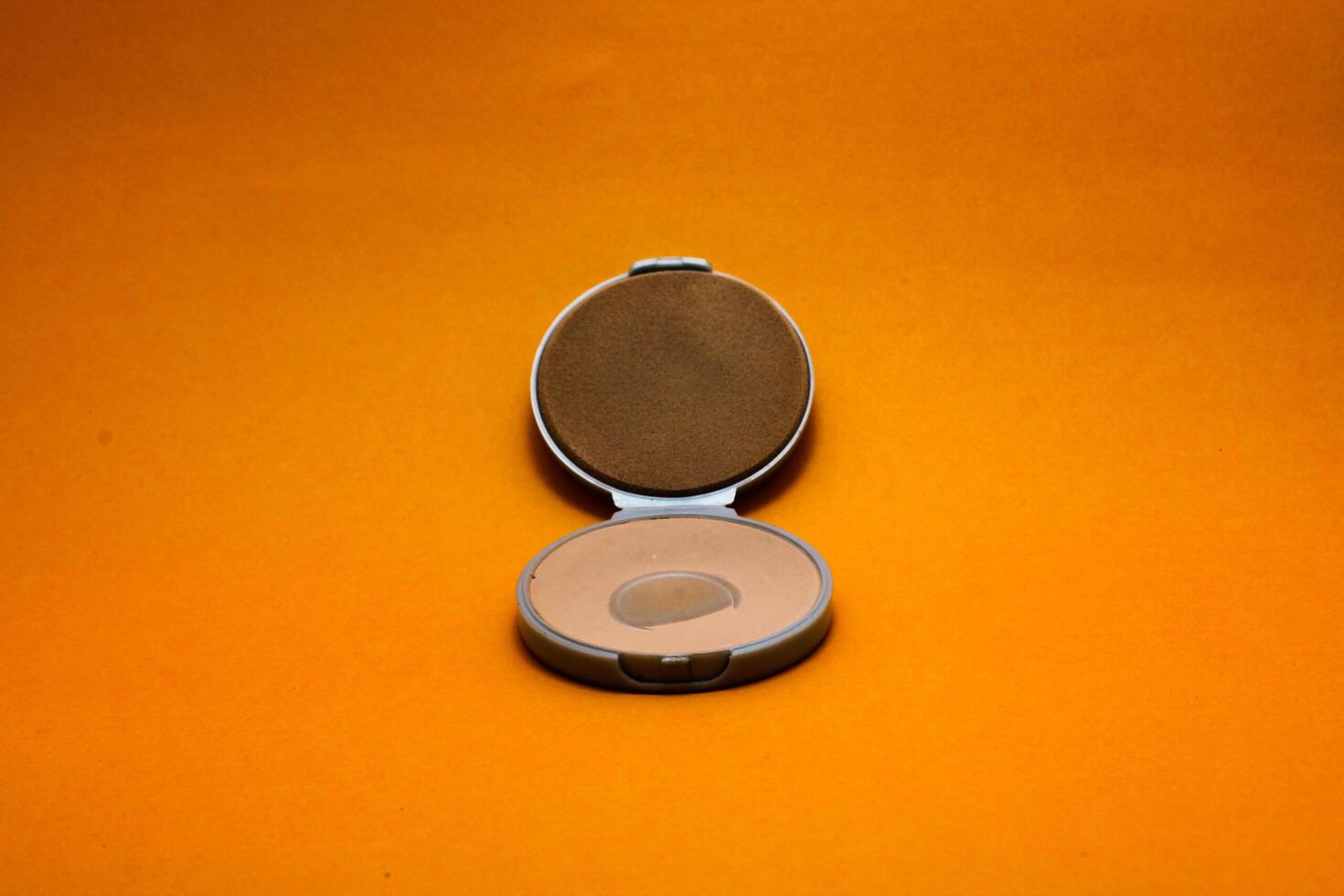 beauty powder isolated yellow background photo