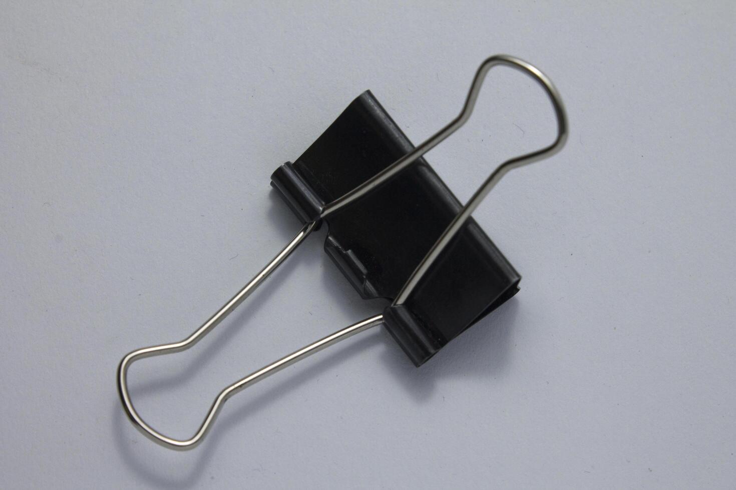 isolated black paper clip photo