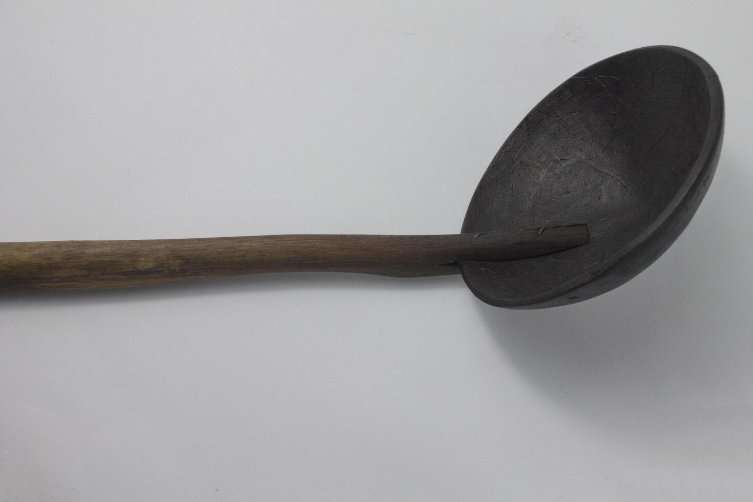 irus, a ladle, a cooking utensil made from coconut shell and bamboo photo