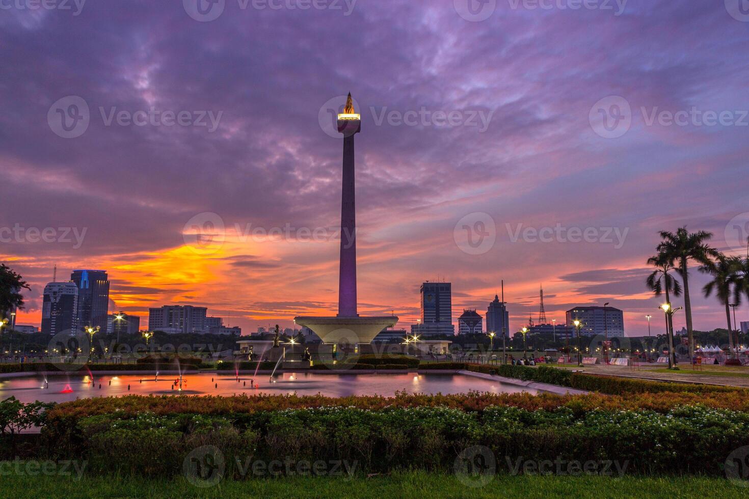 Beautiful landscape of Medan Merdeka Square or National Monument or Monas, Jakarta under the cloudy sunset photo