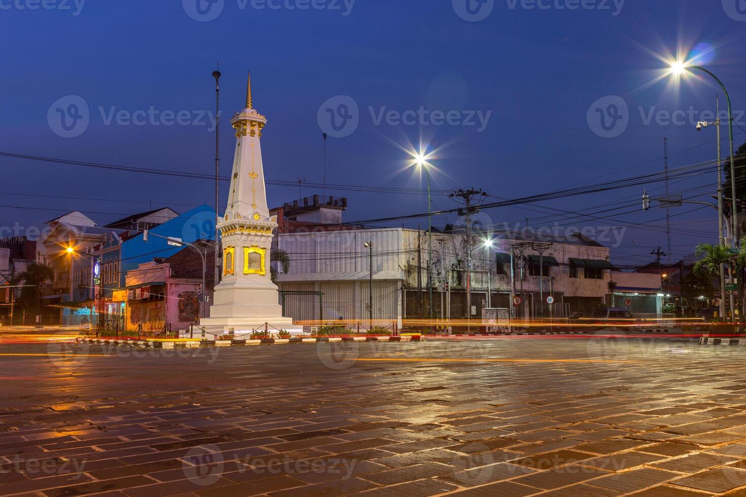 Tugu Yogya, the most iconic landmark in Yogyakarta, Indonesia with beautiful vehicle light trail photo