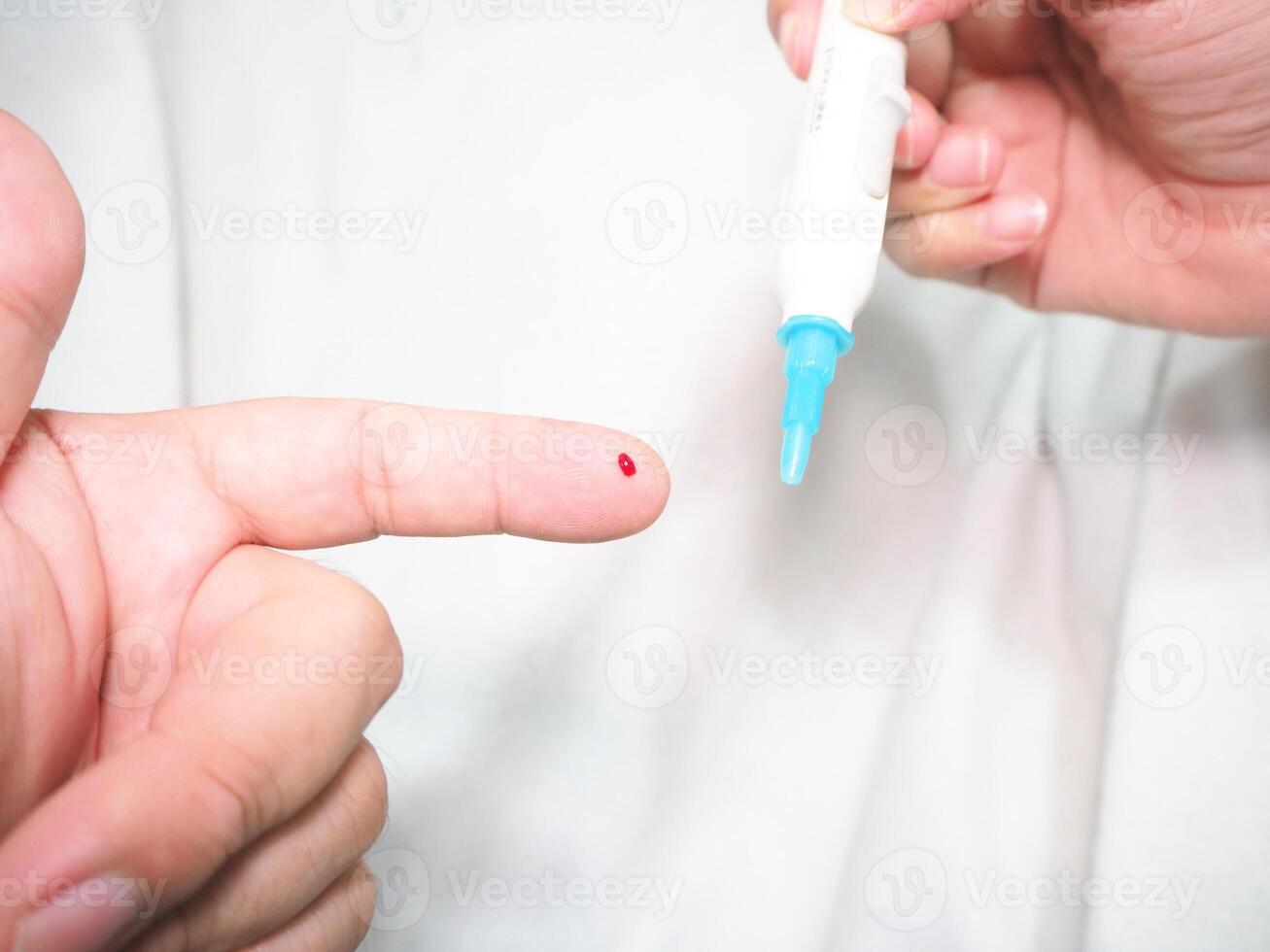 Healthcare and medical concept, The diabetic measures the level of glucose in the blood. photo
