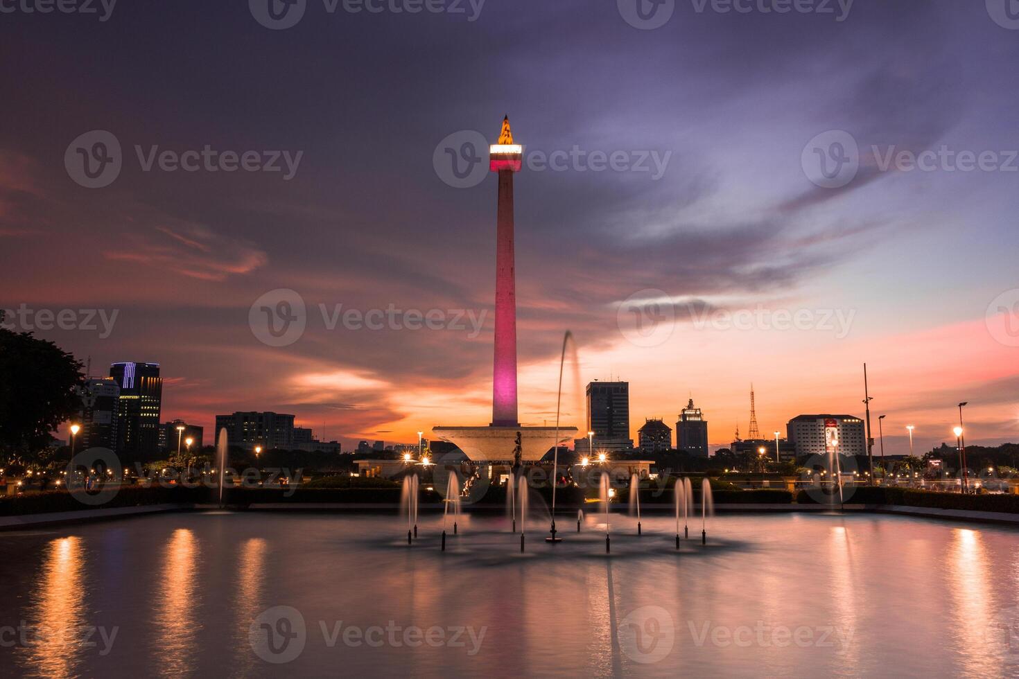 Beautiful landscape of Medan Merdeka Square, Jakarta under the cloudy sunset photo
