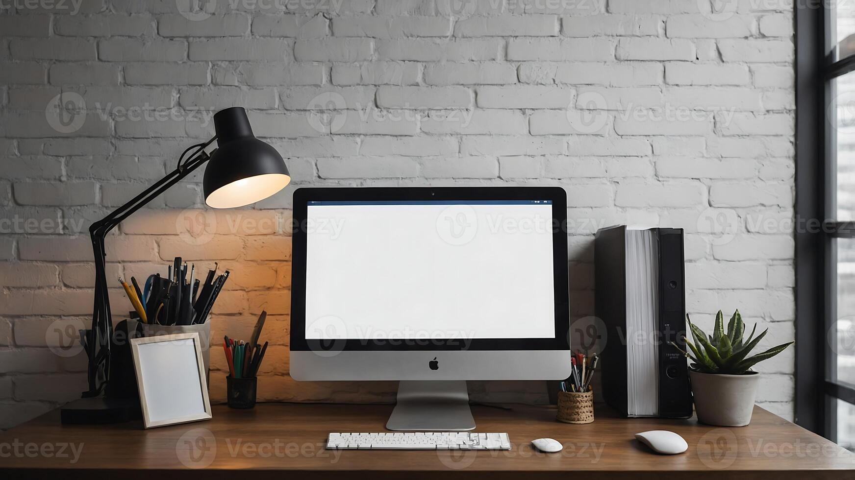 A computer monitor on a desk with a lamp and a lamp photo