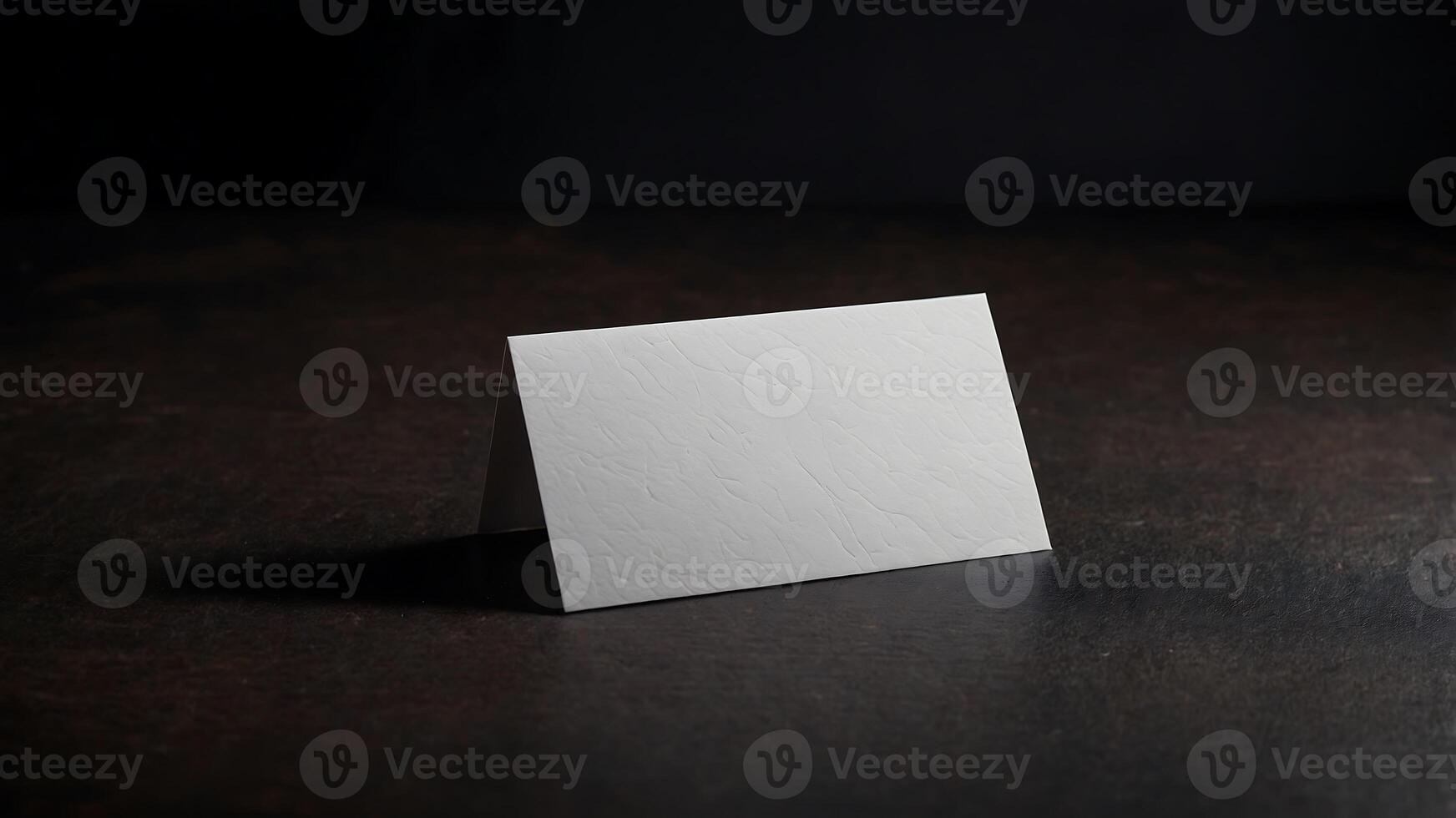 A white card sitting on a table photo