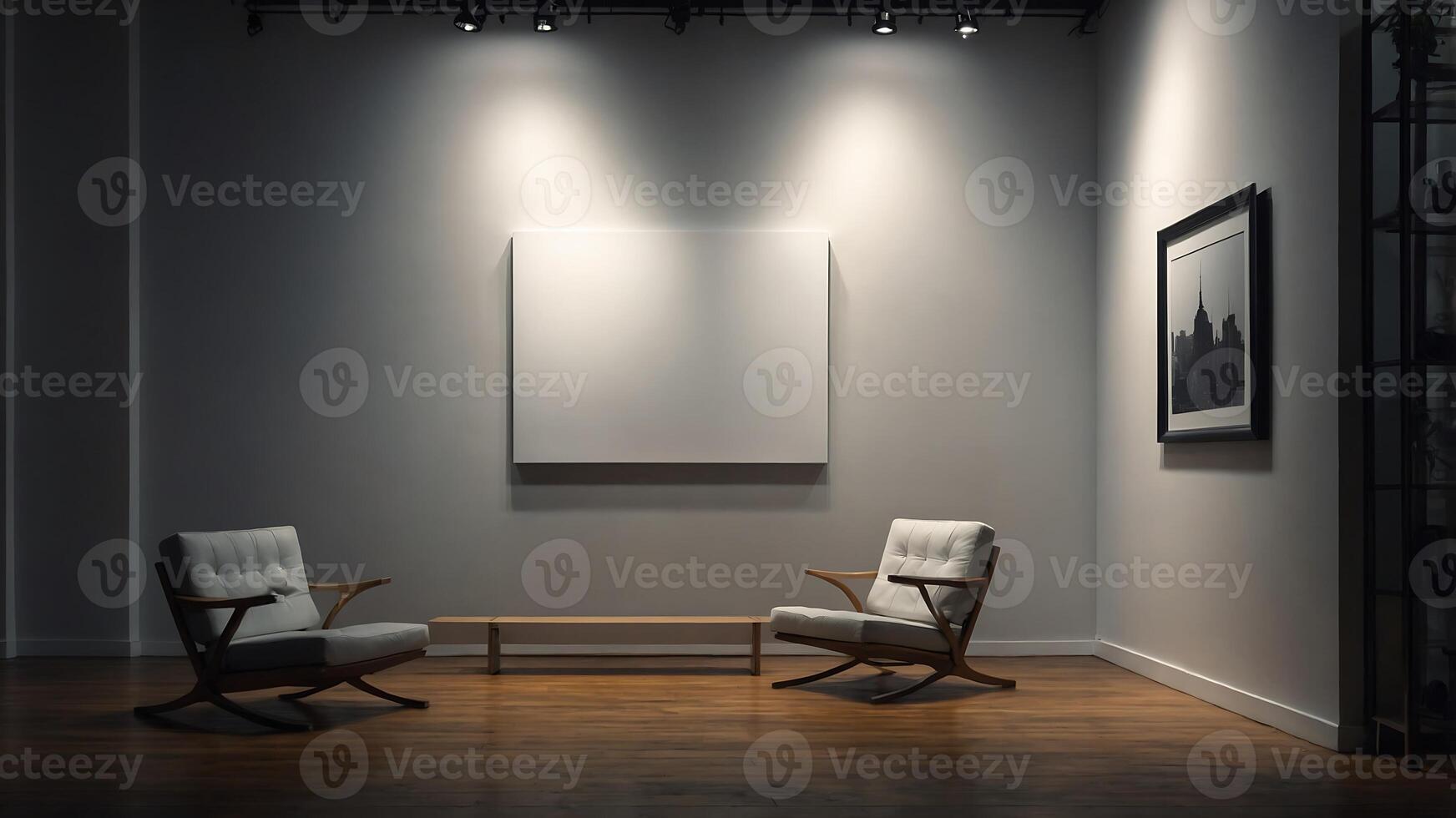 Two chairs in a room with a large blank canvas photo