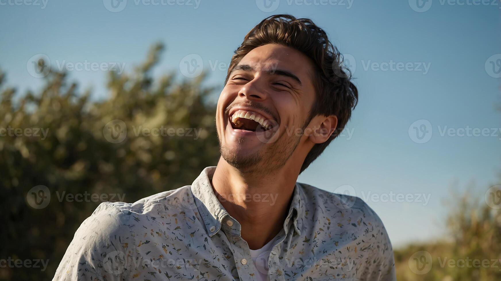 A man is laughing in the field photo
