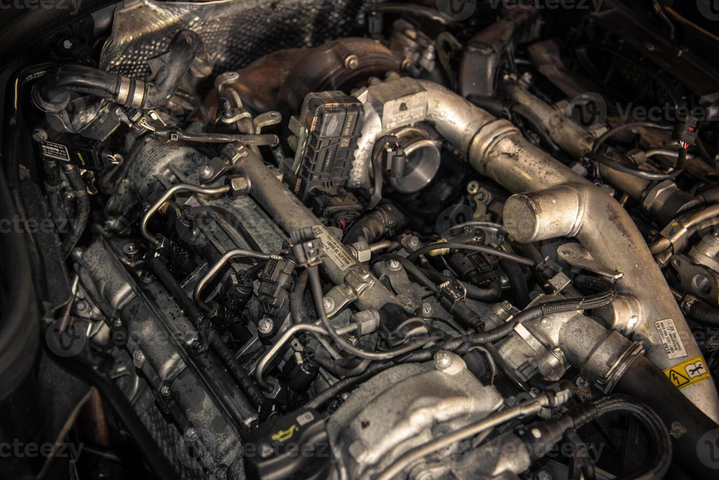Modern vehicle diesel engine in a garage ready for service photo