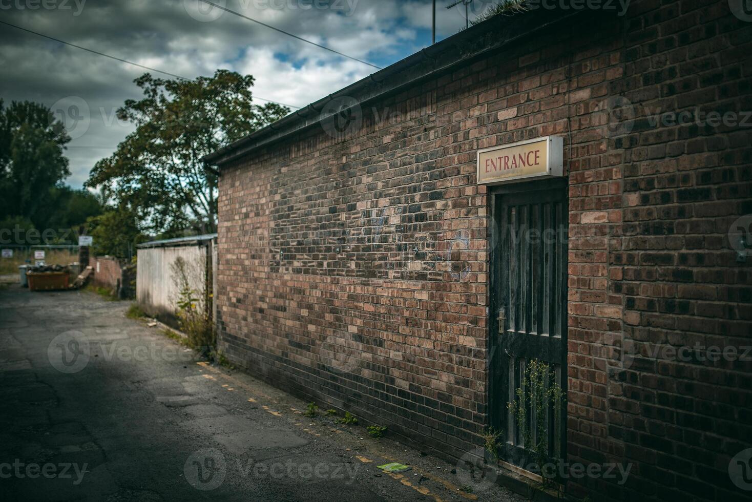 Silgle door in a red brick building looks abandon, Nantwich, Cheshire, UK photo