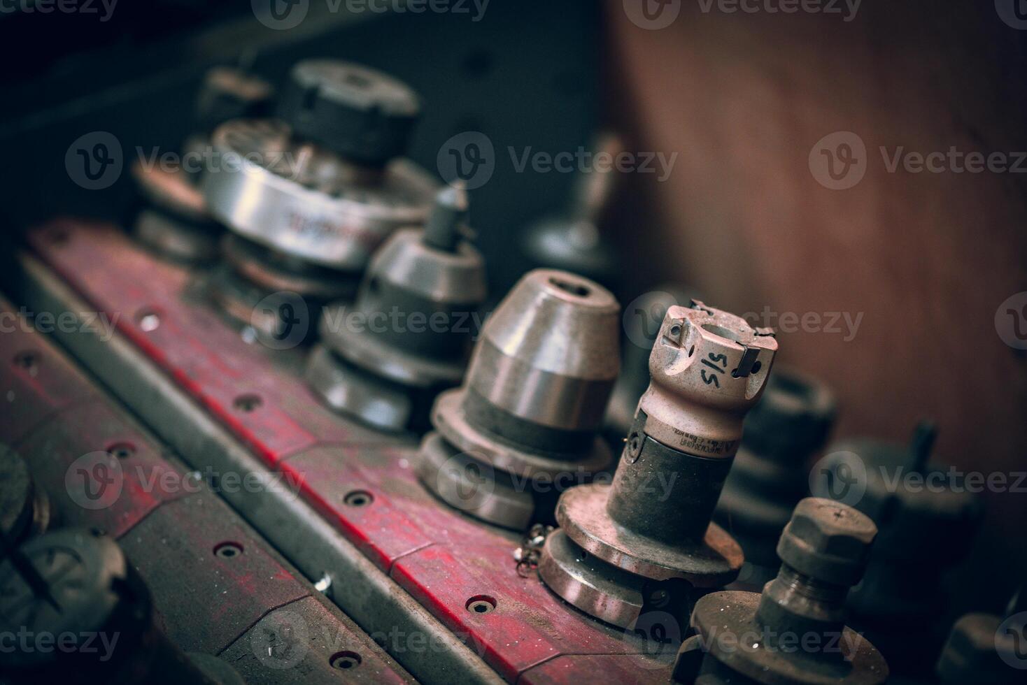 CMC machine spindle tools in a dusty toolbox in a metal workshop photo