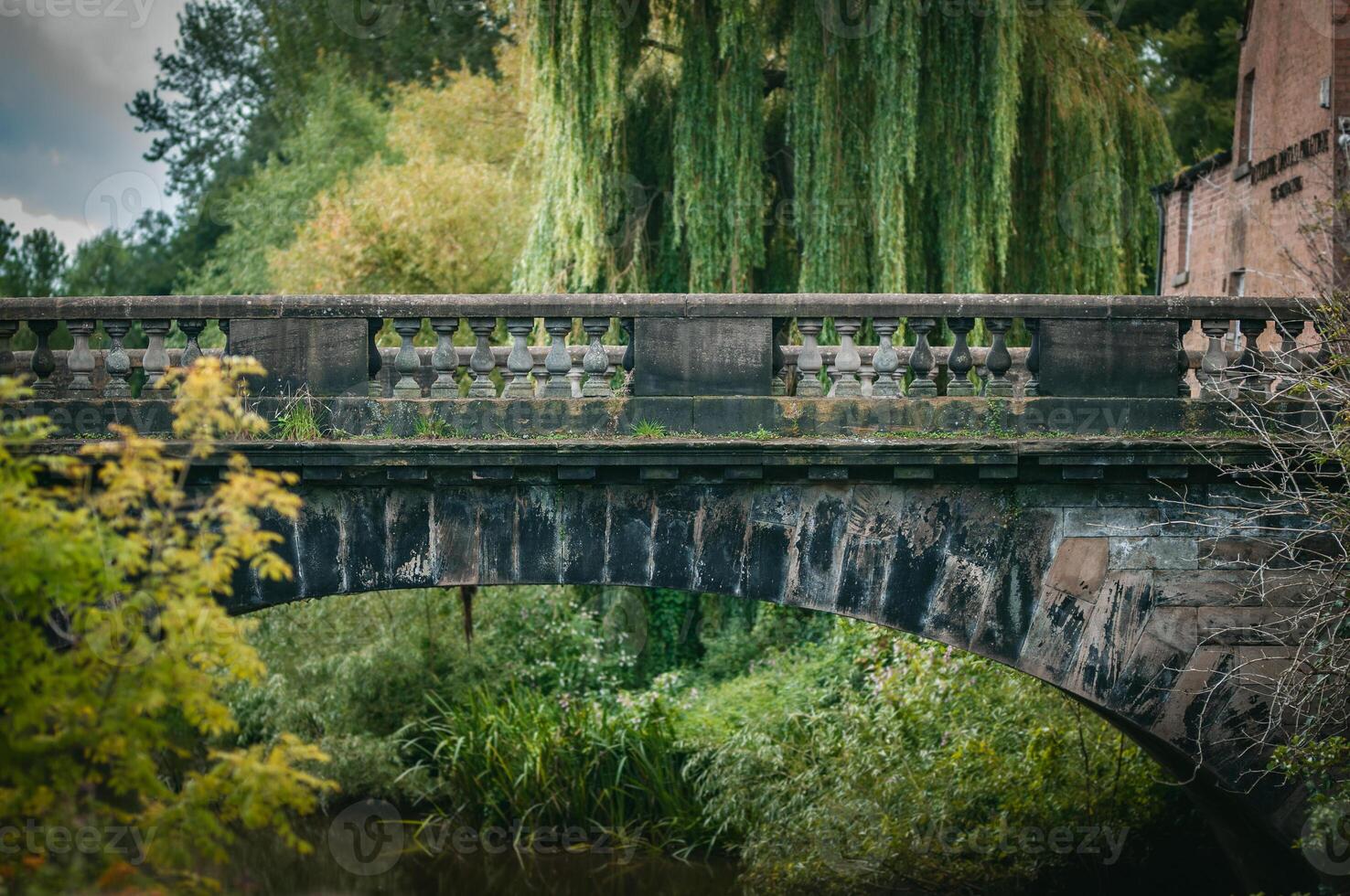 Old stone bridge close to center of Nantwich, an old town, Cheshire, England photo