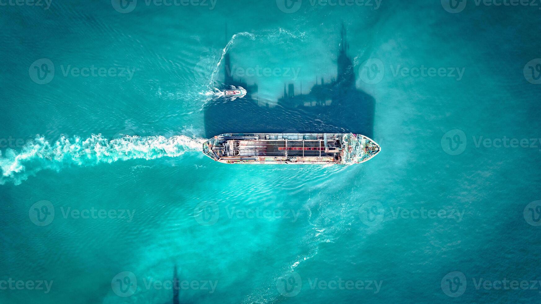 Aerial view of cargo ship in blue waters by Newhaven port, East Sussex, UK photo