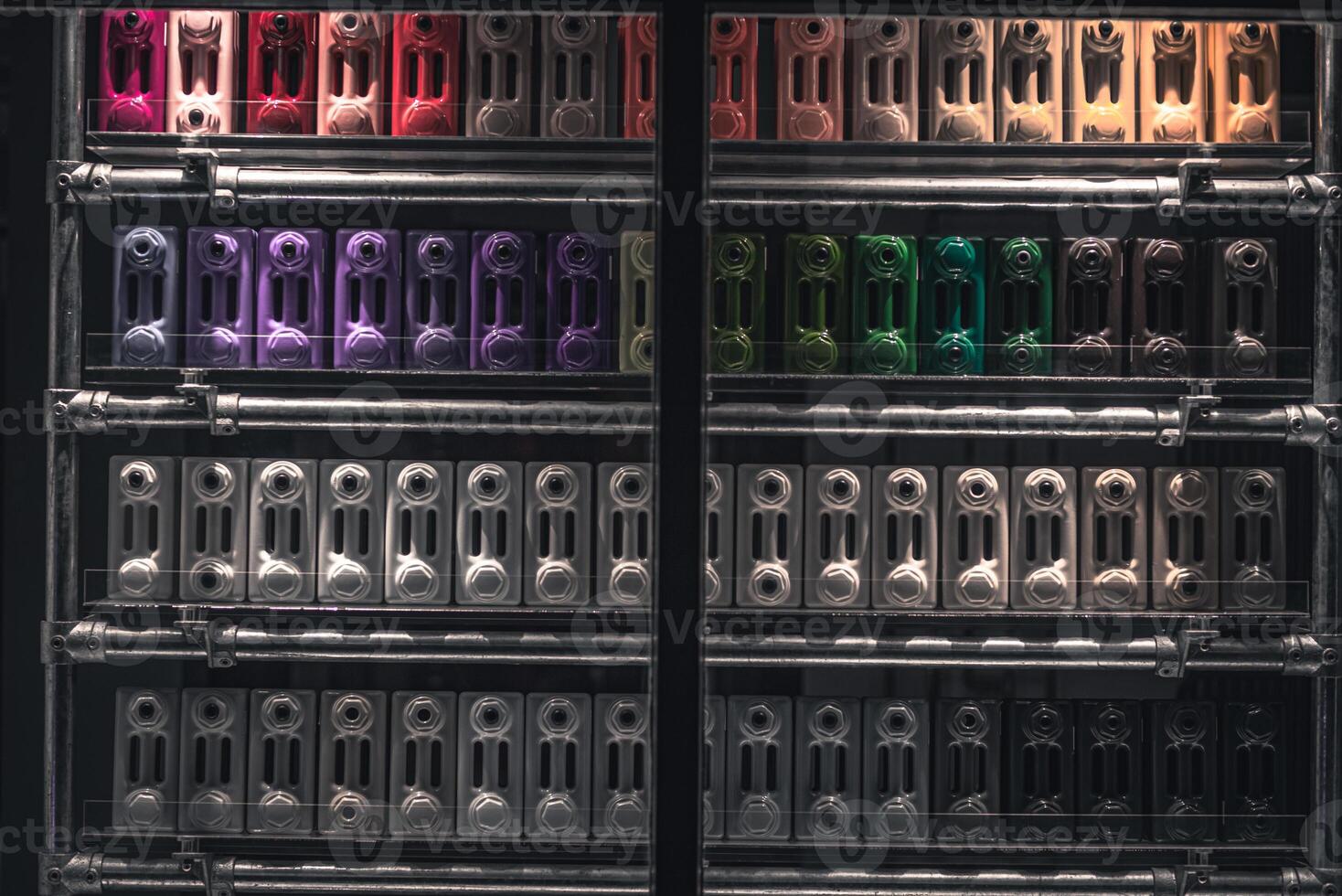 Stacked up colourful heating radiators on a front window display, Brighton, East Sussex, UK photo