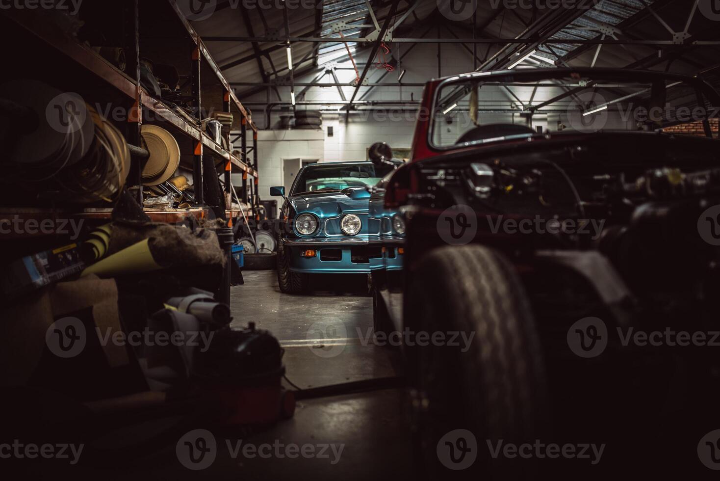 Classic cars being restored in a vintage vehicle garage workshop photo