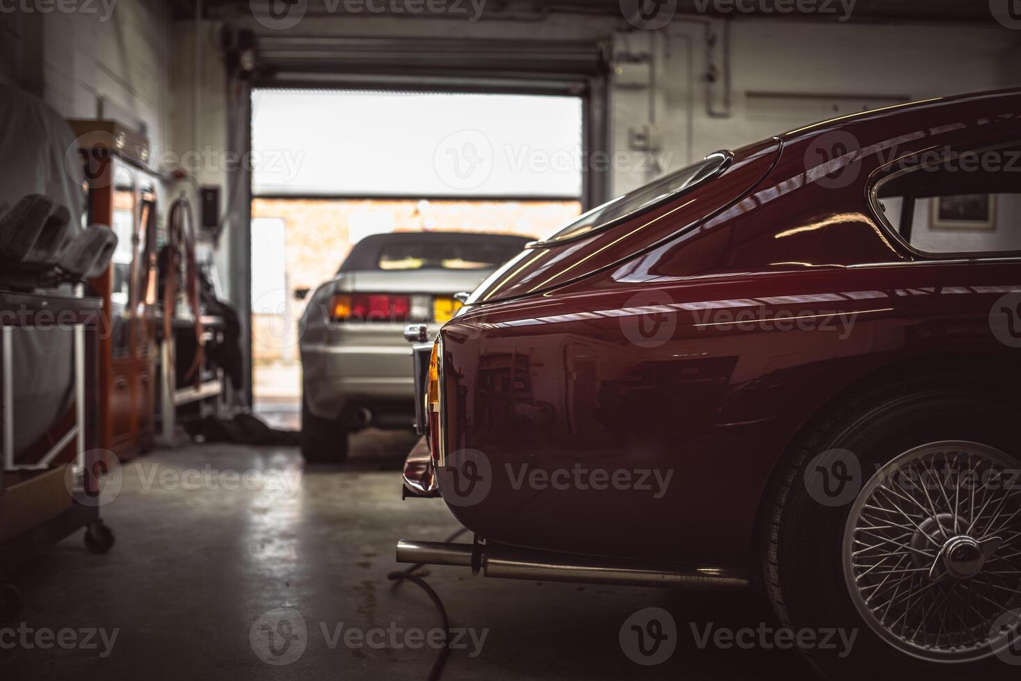 Classic cars being restored in a vintage vehicle garage workshop photo