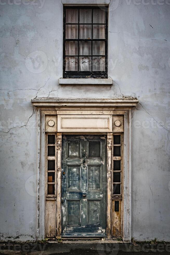 Old entrance to an abandon house in Brighton, East Sussex, UK photo