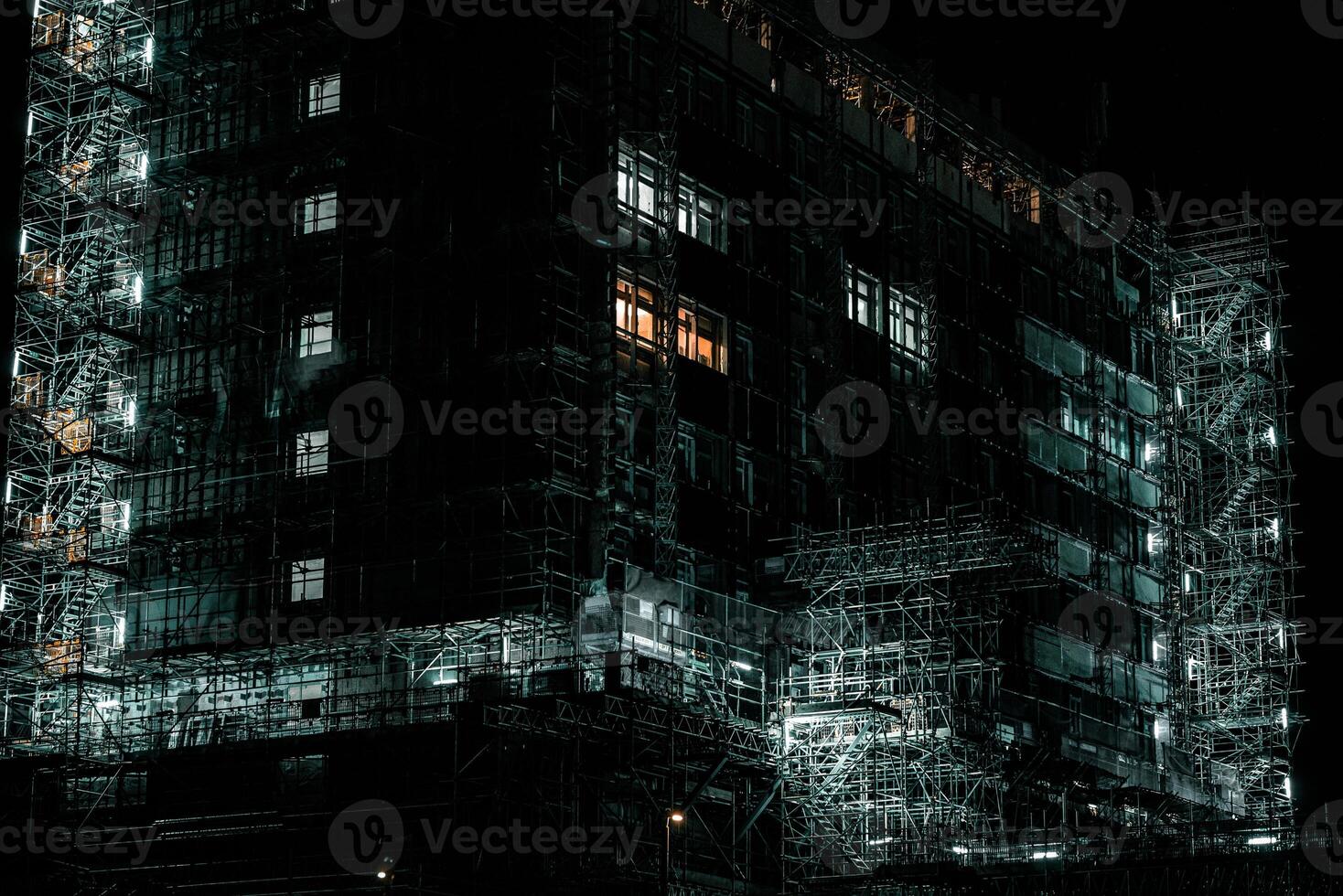Lights on scaffolding around the building site. photo