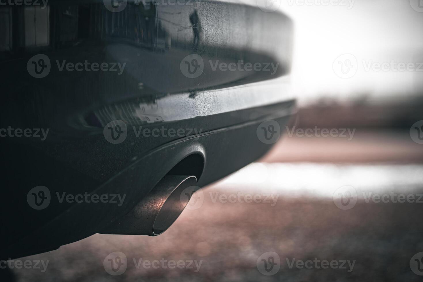 Close up exhaust pipes pipe of a modern car photo