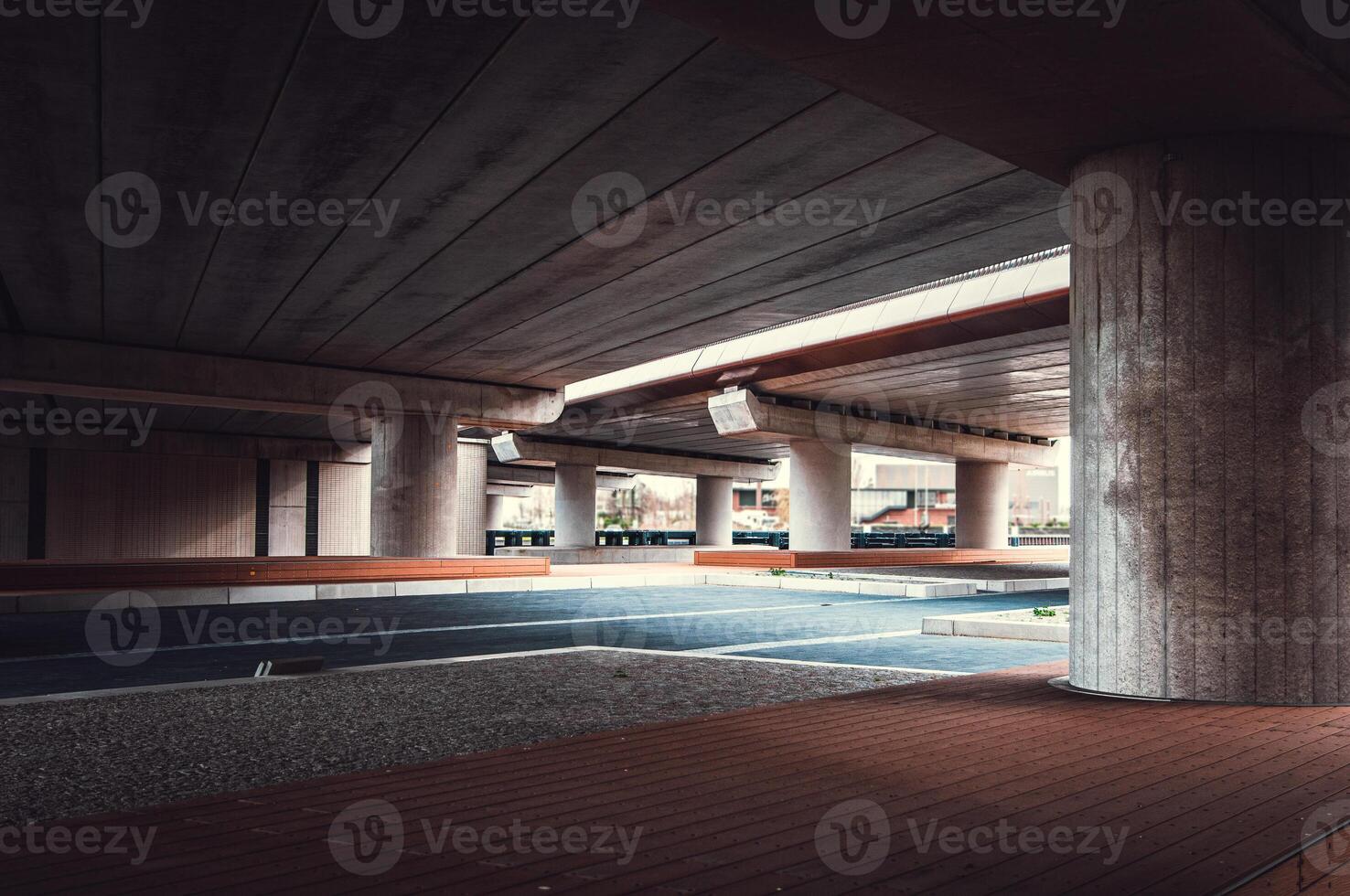 Parking lot under the bridge with few visible columns, Netherlands photo