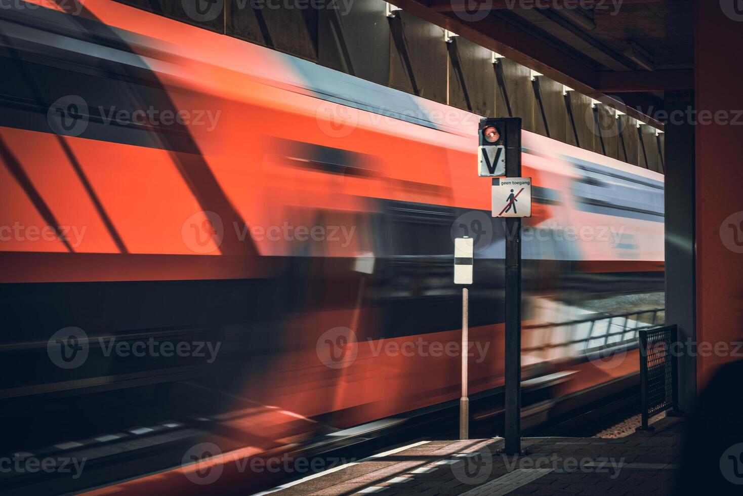 High speed train passing by one of the platforms somewhere in Netherlands photo