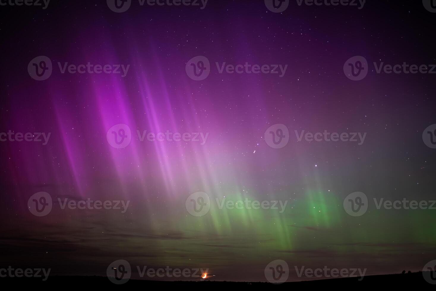 Northen lights in unusual place, with visible stars and moon on horizont, Brighton, East Sussex, UK photo