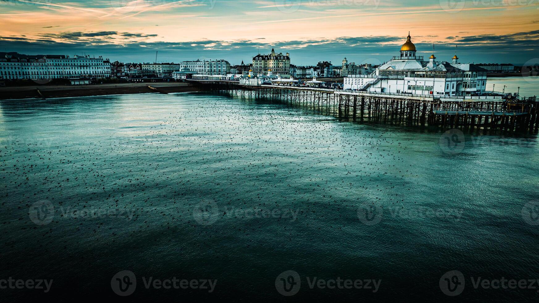 Aerial view of a Eastbourne pier on a cold but clear day with calm waters surrounding it, Eastbourne, East Sussex, UK photo
