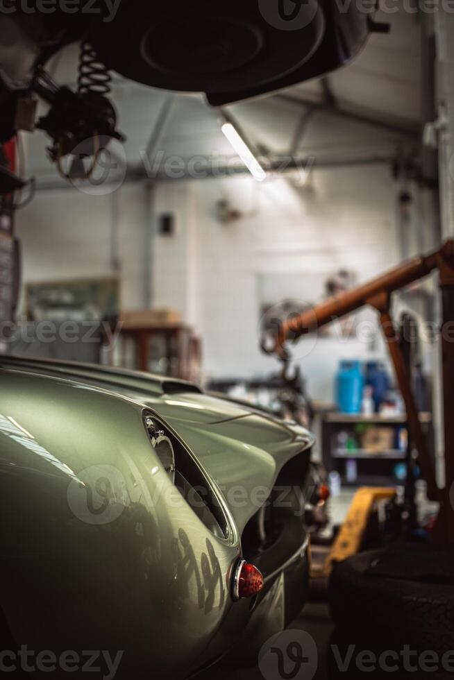 Classic cars being restored in a vintage vehicle garage workshop photo