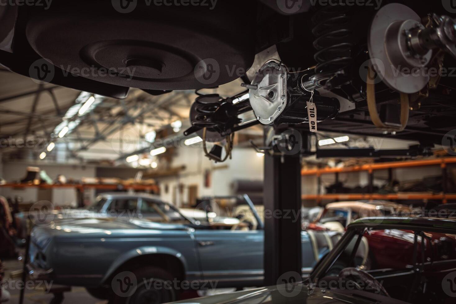 Classic cars being restored in a vintage vehicle garage workshop photo