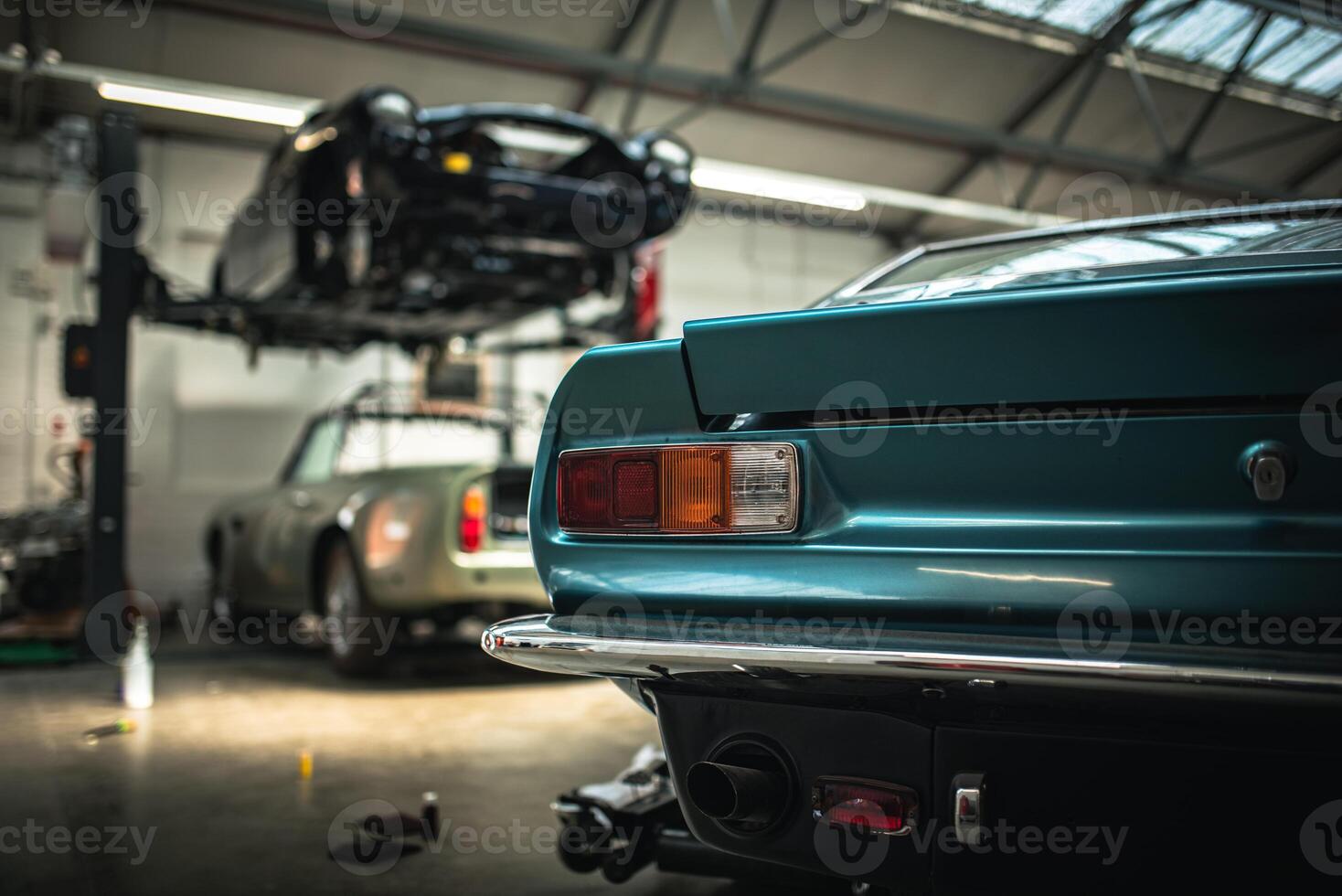 Classic cars being restored in a vintage vehicle garage workshop photo