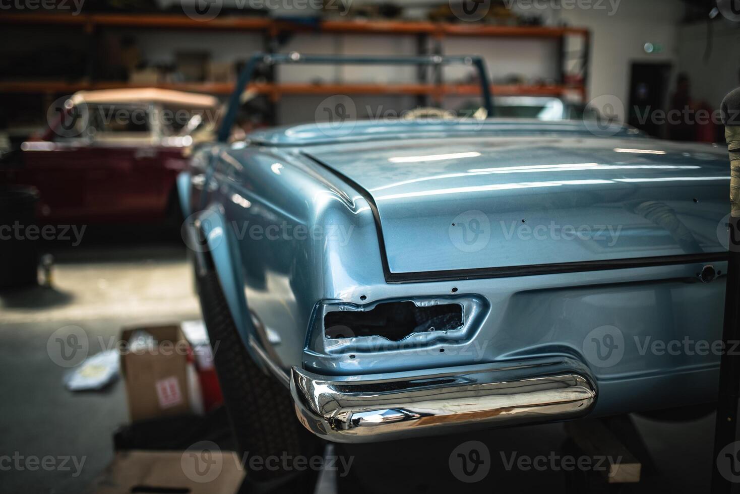 Classic cars being restored in a vintage vehicle garage workshop photo